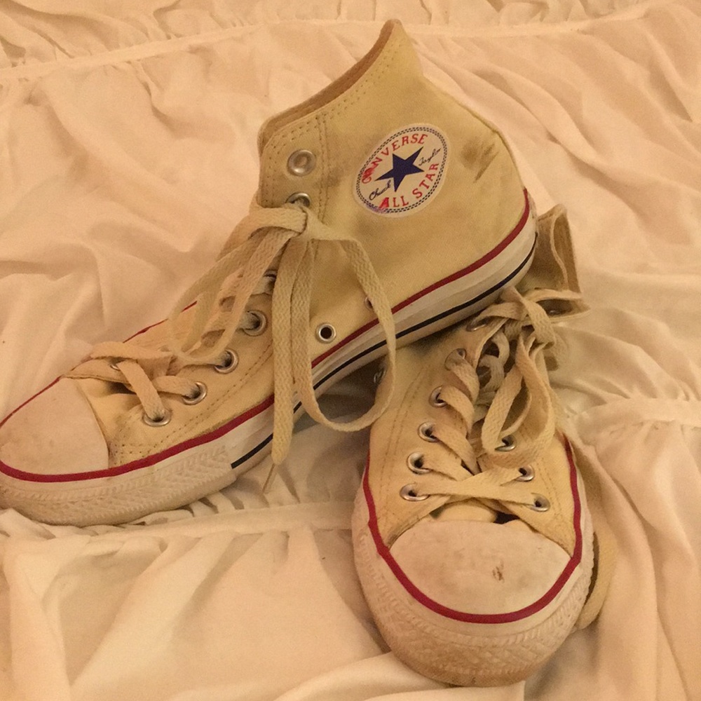 Cream colored high top Chuck Taylor Converse